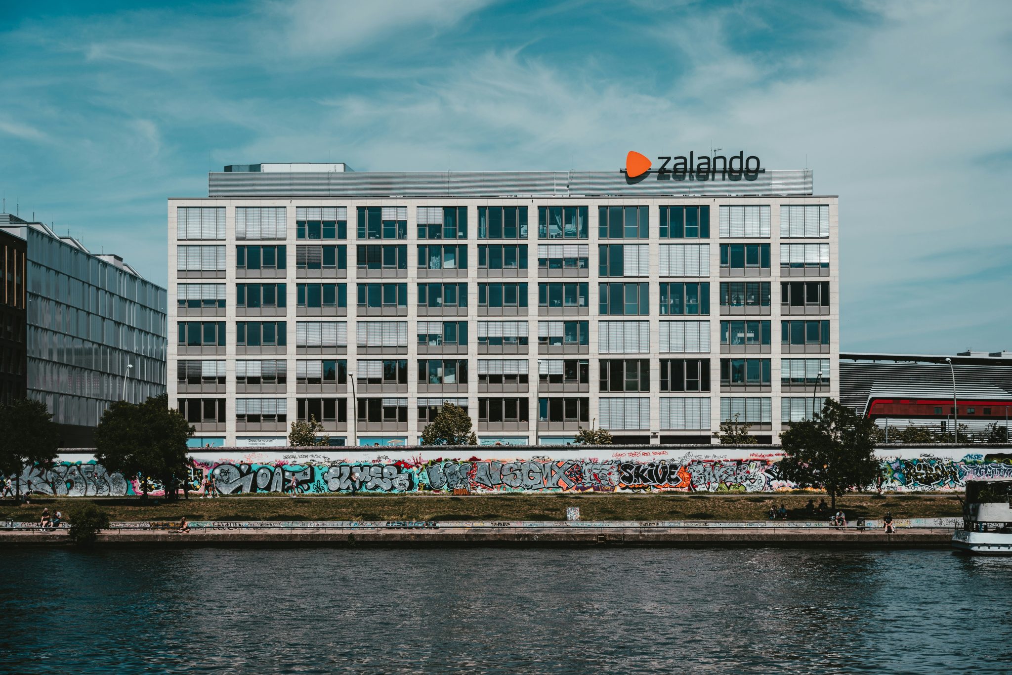 Zalando office building in Berlin. The river Spree and a part of the former Berlin wall is visible in the foreground